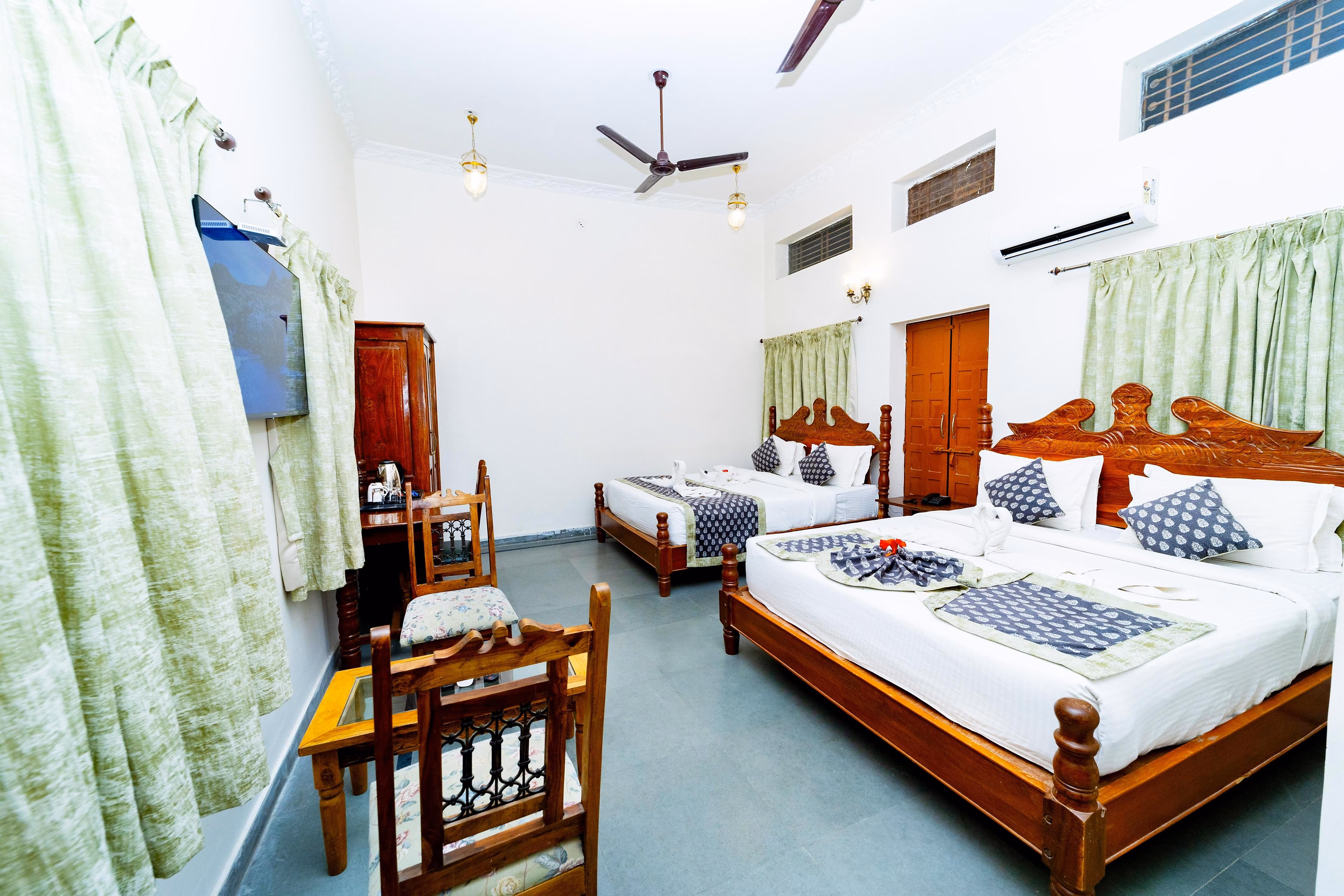 A family suite with multiple beds and a spacious layout