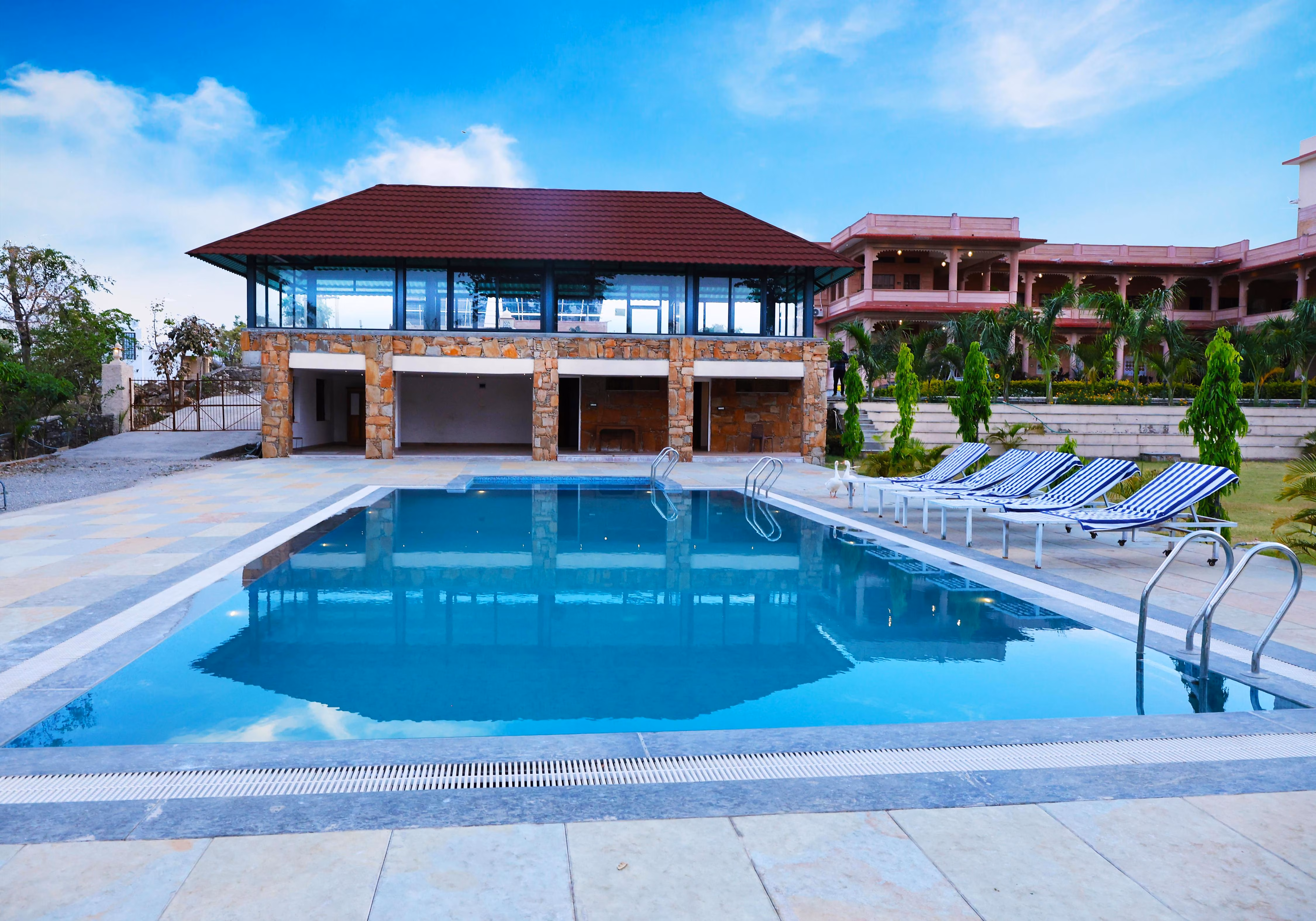 Luxury suite with a king-sized bed and pool view